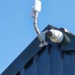 CCTV system on top of black metalling building by Mech-Elec Group Ltd