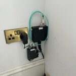 Broadband router plugged into electric socket by Mech-Elec Group Ltd